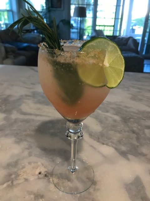 Mocktail garnished with Rosemary from "cocktail garden"